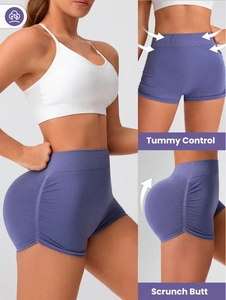 Seamless purple high-waisted yoga shorts featuring tummy control and scrunch butt design
