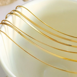 Double-layered 18K gold-plated snake bone chain bracelet in polished titanium steel