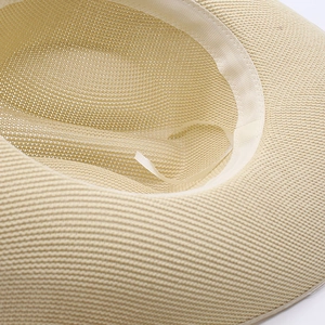 Close-up of woven straw hat interior featuring adjustable inner drawstring and sweatband