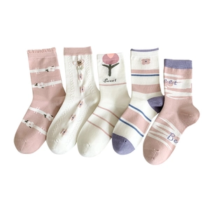 Five pairs of cotton crew socks for women featuring tulip flowers and pastel stripes