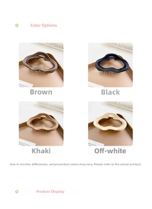 Macro shot of large matte hollow cloud hair claws in brown, black, khaki and beige