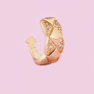 Detailed view of the gold quilted ear cuff featuring clear cubic zirconia accents
