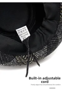 Detail of plaid hat interior featuring adjustable drawstring and cotton blend lining