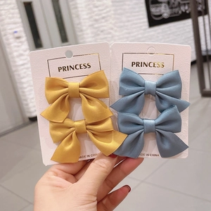 Fermagli per capelli a fiocco per bambine nei colori giallo acceso e blu grigio