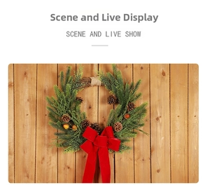 Macro detail of Christmas wreath with PE pine needles, natural cones and red velvet bow
