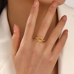 18K gold plated stainless steel intertwined rope knot ring shown on model's finger