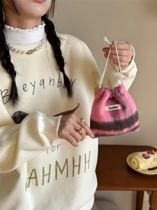 Striped wool-like drawstring bag for cosmetics and jewelry with soft plush texture