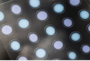 Macro shot of 5D nail art stickers with matte finish and blue-purple gradient dots