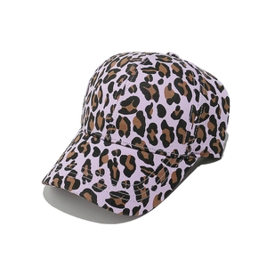Detailed close-up showing the purple leopard print pattern on the canvas baseball cap