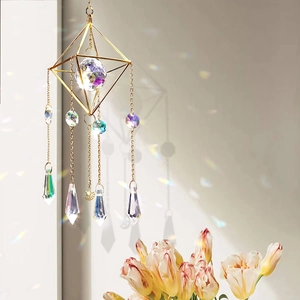 Golden geometric crystal suncatcher with faceted glass ball and star charms for garden decor