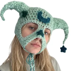 Handmade crochet demon horn beanie in mint green with blue moon and star charms