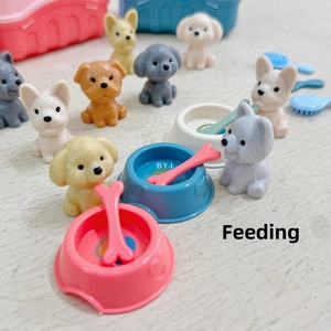 Miniature pet feeding set with diverse dog figurines and toy accessories in a cozy scene