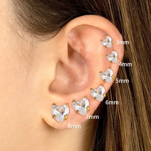 Sparkling zircon heart stud earrings in six sizes from 3mm to 8mm shown on ear