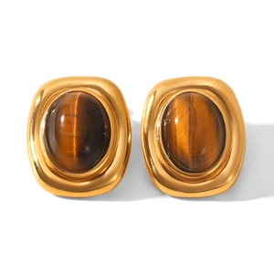 Detail of vintage square gold stud earrings featuring oval tiger eye natural stone insets