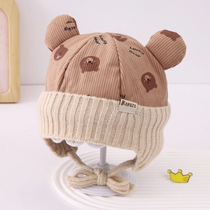 Detail of baby winter hat featuring cute 3D bear ears and Lucky Bear pattern