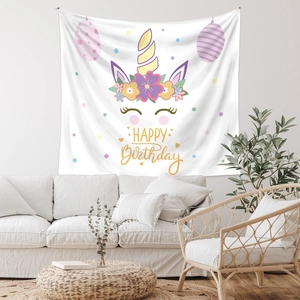 Close-up of bohemian unicorn happy birthday wall tapestry for room decoration