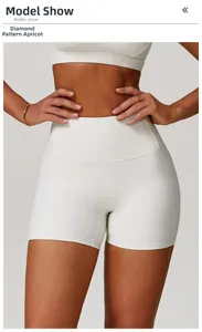Detailed view of high-waisted yoga shorts in almond beige featuring soft cloud-feel fabric