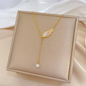 Gold Y-shaped titanium steel necklace featuring a mother of pearl wing and zircon pendant