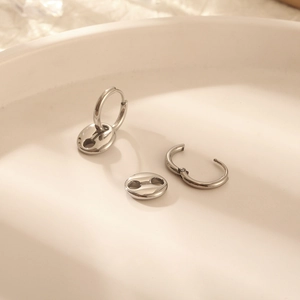 Minimalist silver coffee bean hoop earrings in polished stainless steel for women