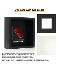 Detail of 3D black shadow box frame featuring dual-sided black and white mat board inserts
