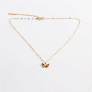 Golden stainless steel butterfly pendant necklace with crystal accents on a thin chain