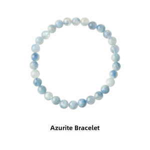 Macro shot of natural azurite beaded bracelet with translucent blue texture and polished finish