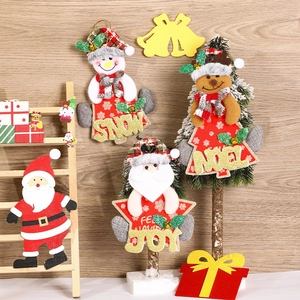 Detailed fabric Christmas pendants with glitter letters on rustic wooden background