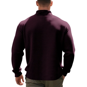 Detail of burgundy waffle knit texture on men's relaxed quarter-zip pullover back view