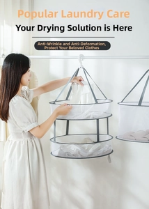 Detail of a double-layer mesh drying basket showing a shirt being placed for flat drying