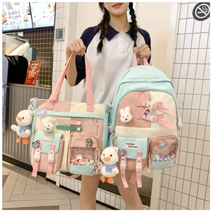 Detail of school backpack with macaron patchwork and cute plush animal accessories