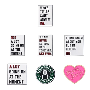 Set of 7 colorful enamel pins featuring Taylor Swift lyrics and geometric dialogue shapes