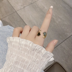 Close-up of S925 sterling silver geometric open ring with dark irregular decorative blocks