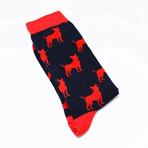 Detailed close-up of navy knit socks featuring red chihuahua patterns and toe accents