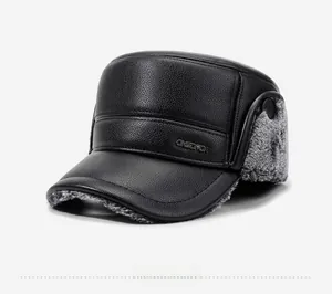 Close-up of winter flat top cap featuring black leather exterior and grey faux fur lining