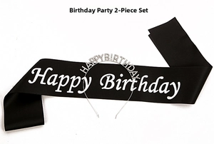 Close-up of birthday party set with silver rhinestone headband and black satin sash