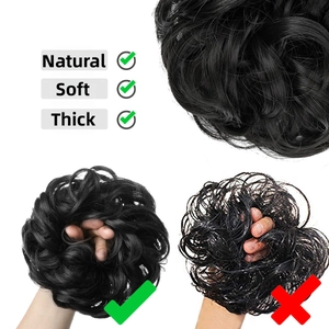 Macro view of high-density synthetic messy bun hairpiece with thick black curly texture