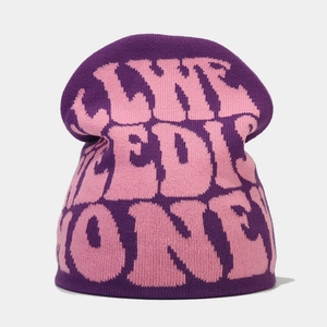 Close-up of Y2K purple and pink jacquard knit beanie with Life Medic One lettering
