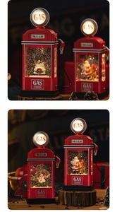 Vintage red Christmas gas station water lantern with Santa Claus on a rustic wood base