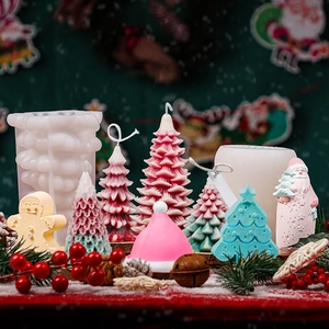 Christmas tree silicone mold with assorted festive DIY candles and holiday decorations