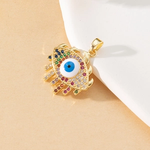 Close-up of golden evil eye pendant with colorful cubic zirconia and enamel detail