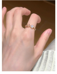 Close-up of S925 silver double flower ring with pink pearl and crystal details on hand