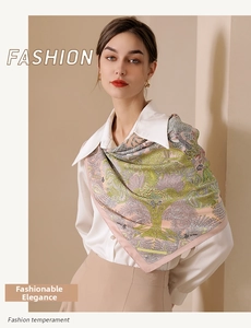Detail of silk-like floral scarf with tropical trees print and elegant pink borders