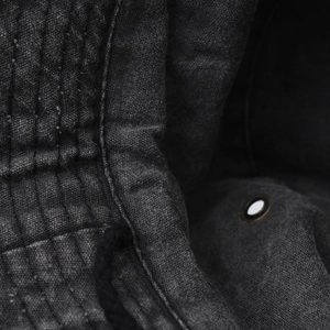 Detail of washed cotton sun hat with metal eyelet, stitching and breathable drawcord