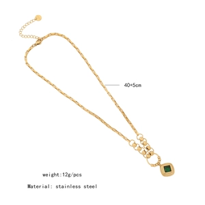 Macro shot of gold emerald square necklace with specs showing 40+5cm length and stainless steel
