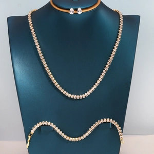 Detailed view of teardrop zircon jewelry set on luxury teal velvet display stand