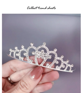 Detailed view of silver rhinestone crown headband with elegant crystal encrusted pattern