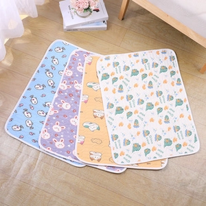 Flat lay of four waterproof flannel pet blankets with colorful cartoon fish and cat patterns