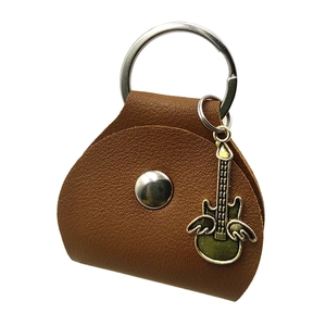 Brown leather guitar pick holder keychain with green wing pendant and silver metal ring