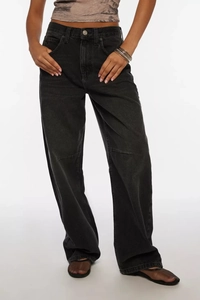 Detailed view of high-waist washed black wide-leg jeans with premium drape and texture