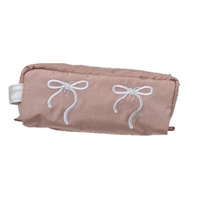 Pink fabric pencil case with white bow embroidery and top zipper handle for students